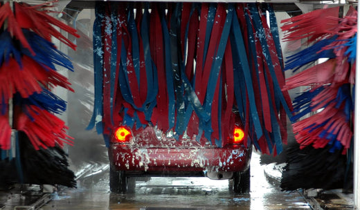A car coming through an automatic car wash.