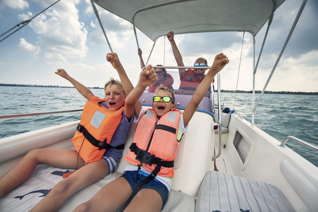 A family wears life jackets while riding in a boat.