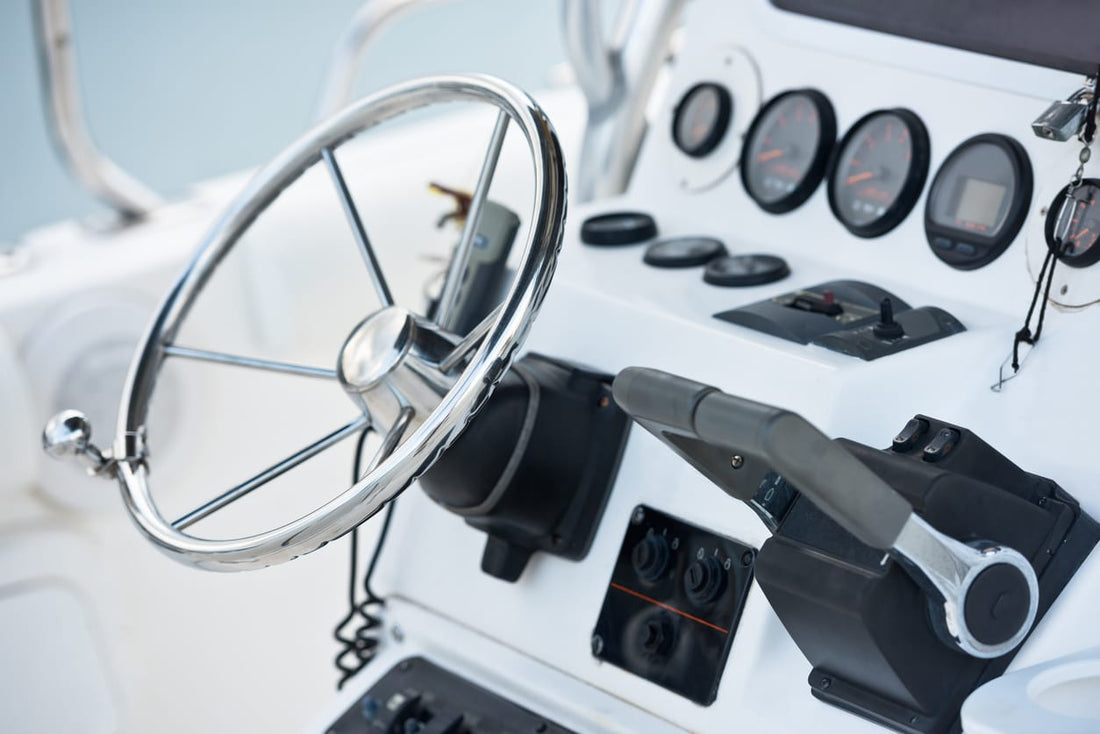 The control panel and steering area of a boat.