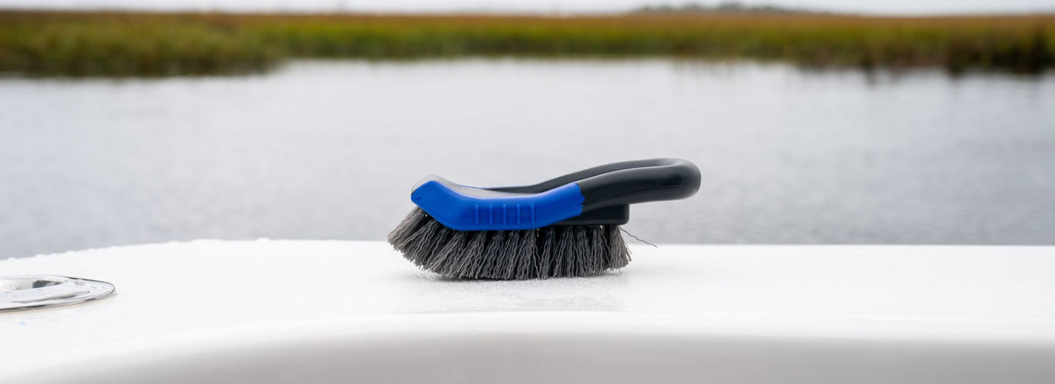 A handheld scrub brush accessory for boat cleaning.
