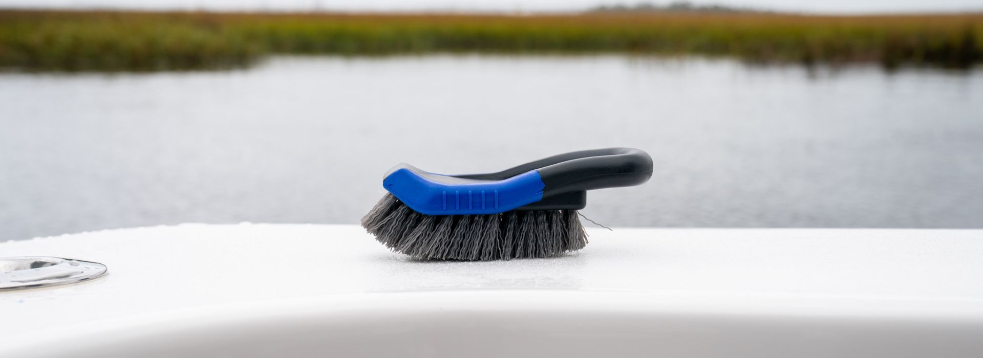 A handheld scrub brush accessory for boat cleaning.
