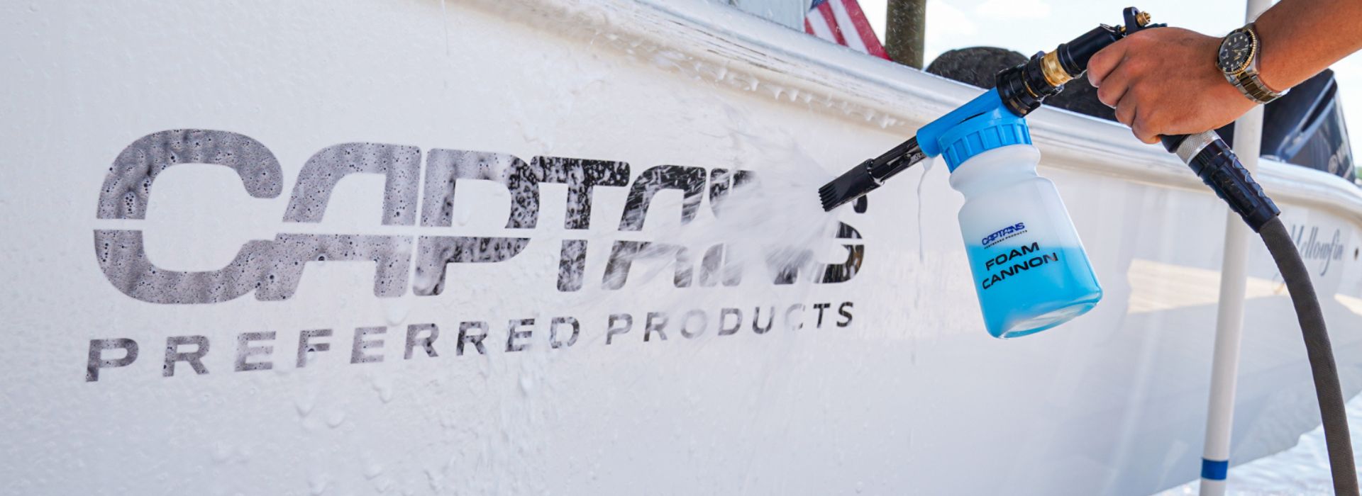 Foam cannon for hose cleaning a boat with Captains Preferred products logo on the side.