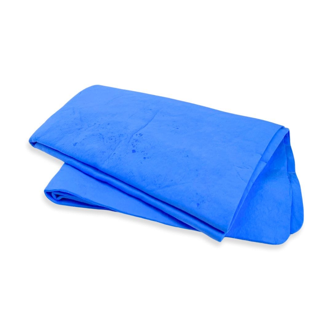 Folded blue chamois towel for drying cars and boats.
