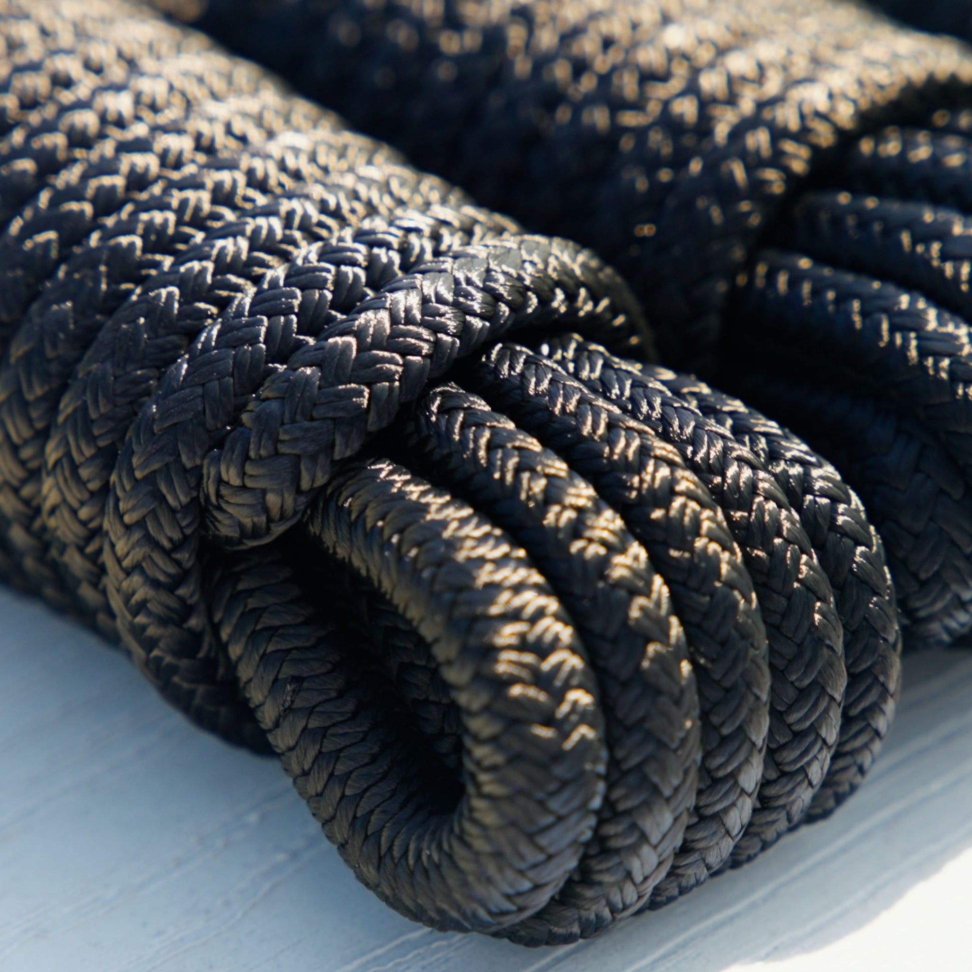 Close up of a black nylon braided dock line for boat docking.