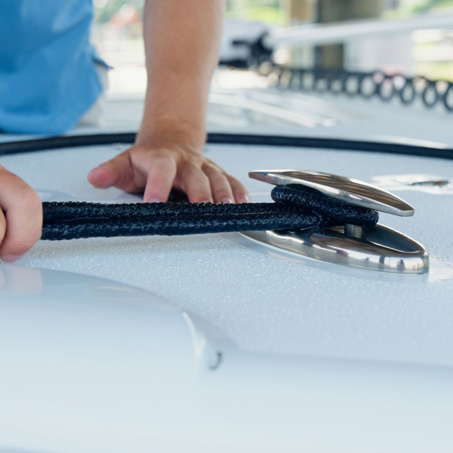 A dock line being tied to a boat cleat.