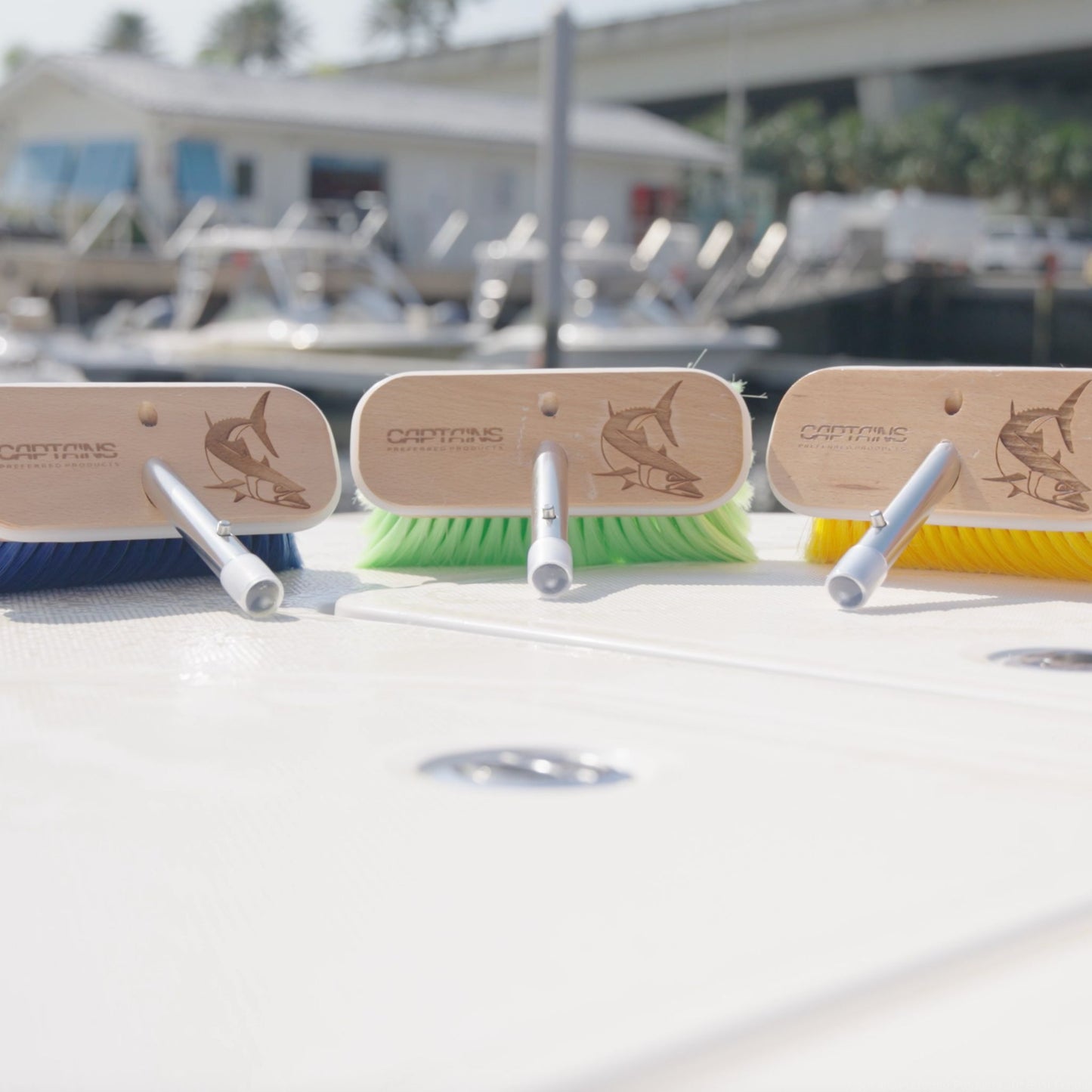 Three personalized boat brushes by Captains Preferred Products.
