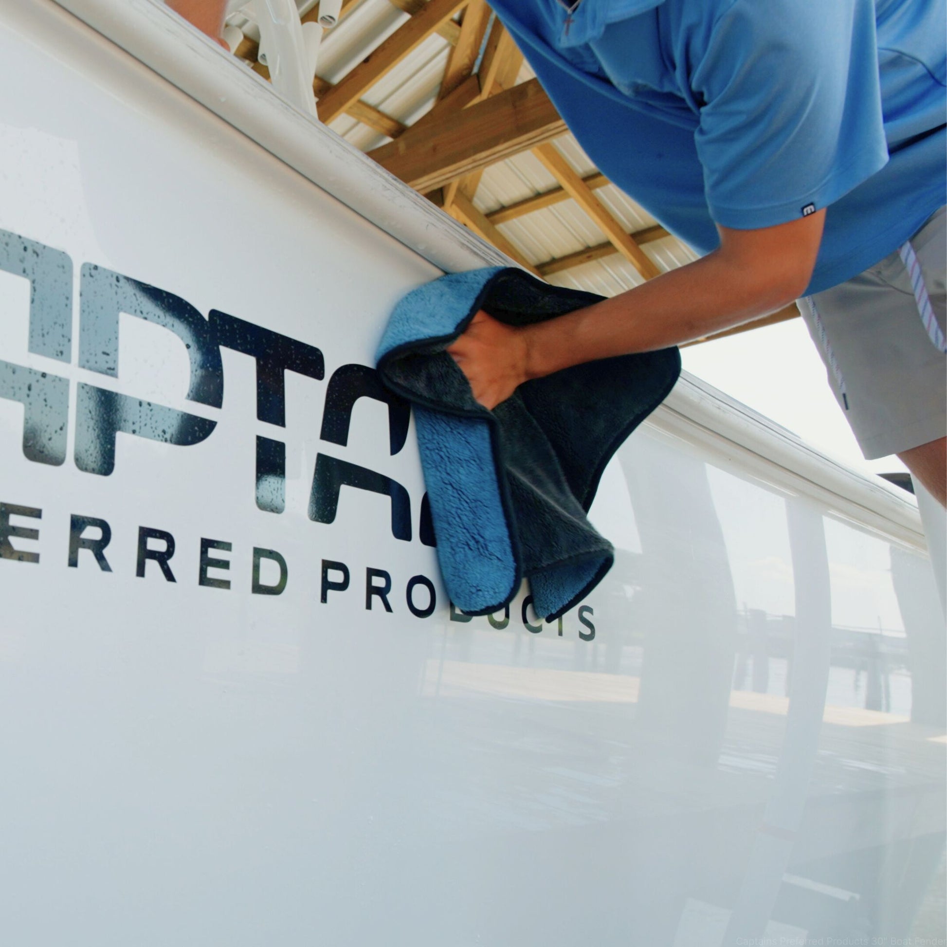 Preventing water spots on a boat after washing with a microfiber drying towel.