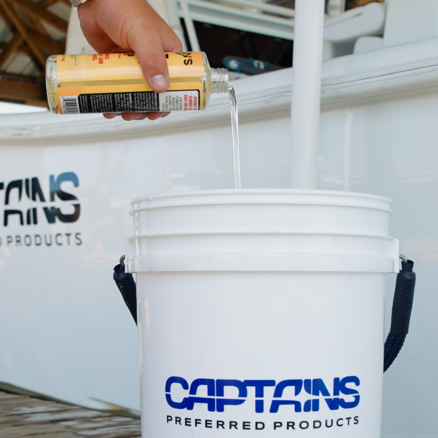 Salt neutralizing soap being poured into a bucket.