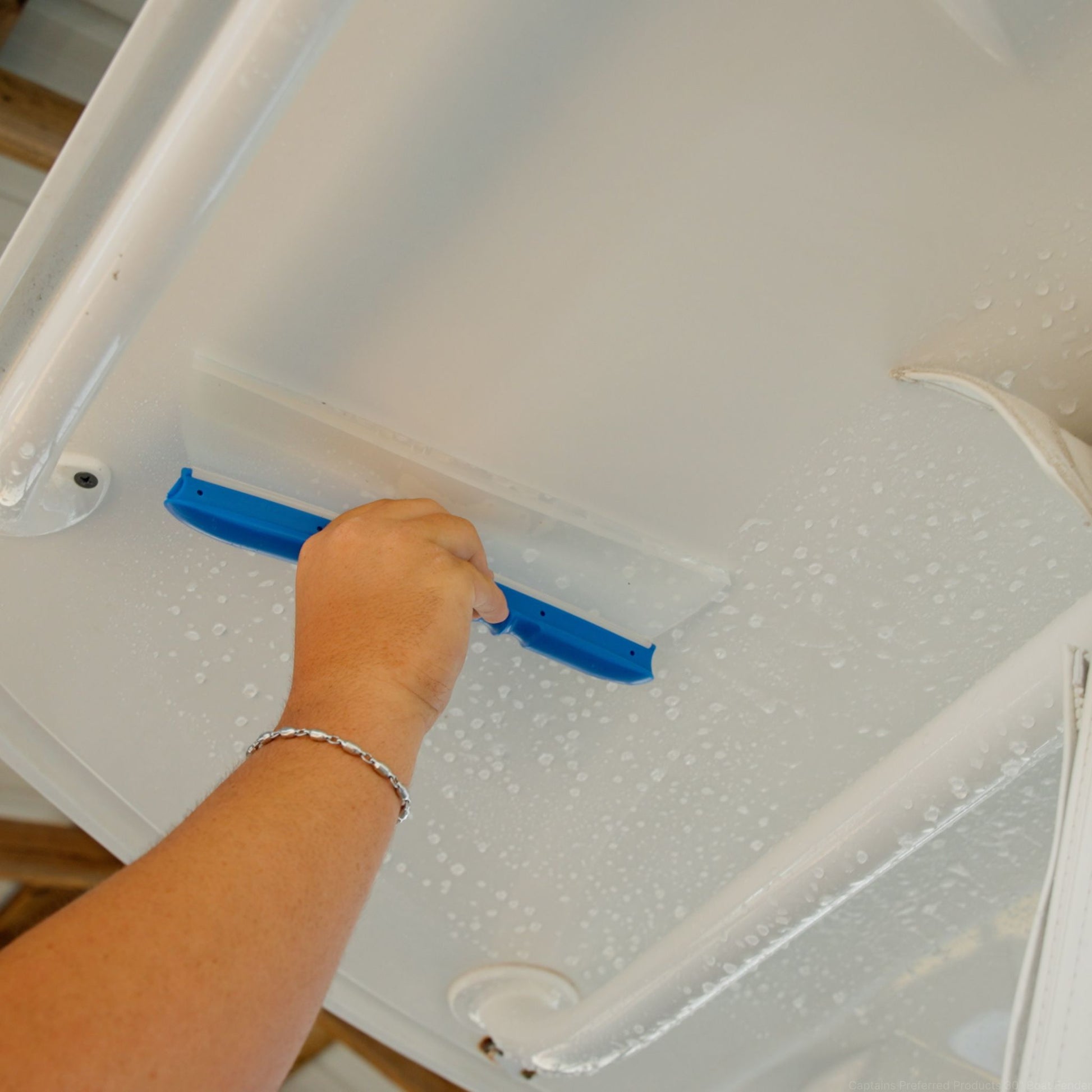 A water blade squeegee drying a boat in one pass.