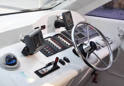 The steering the electronics panel on a boat.