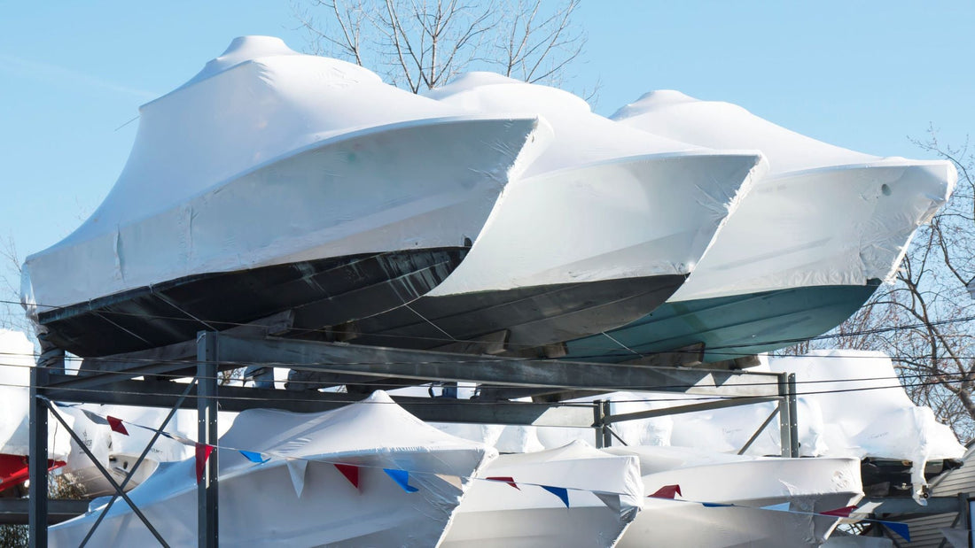 Boats shrink wrapped waiting to be dewinterized and put in the water.