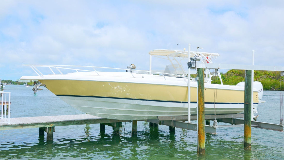 A boat on a boat lift on a dock.