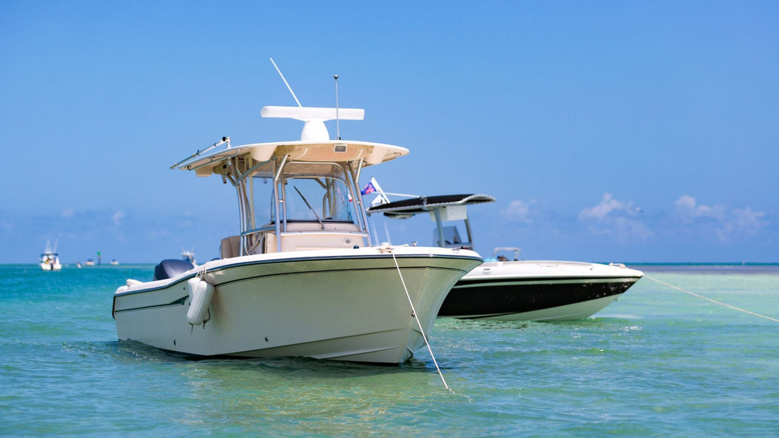 Two boats anchored out in the ocean.