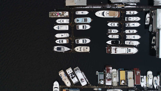 An aerial view of a marina full of boats.