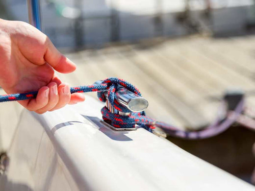 A dock line tied on a boat cleat.