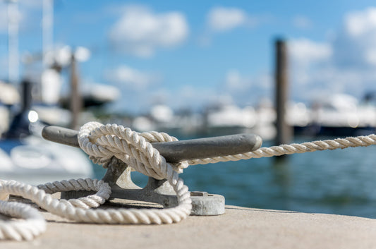 A clean knot tied to keep a boat at a dock.