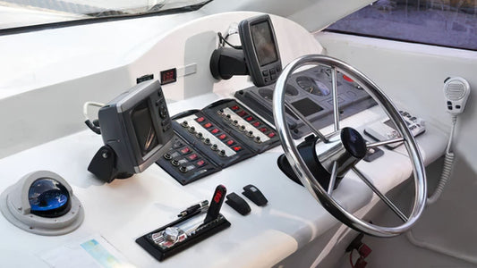The steering wheel in the helm of a boat.