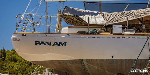 A boat's name on the side of the hull.