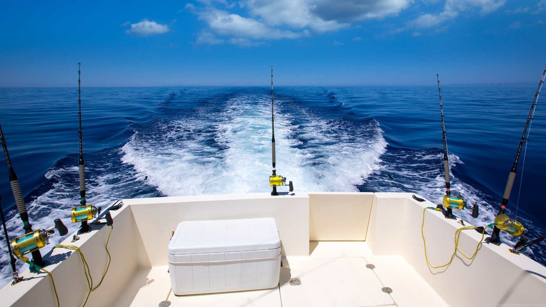 An offshore fishing boat trolling for fish in the open ocean.