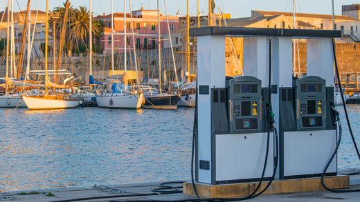 Two fuel pumps at a dockside fueling station for boats.