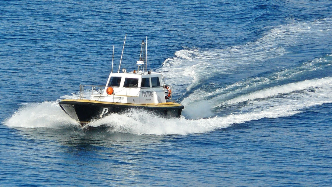 seasonal boat operator cutting through the water.