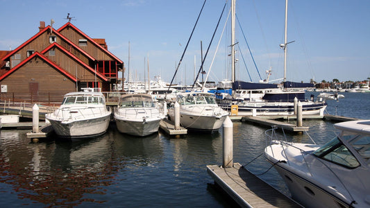 Boats docked in boat slips at a marina.