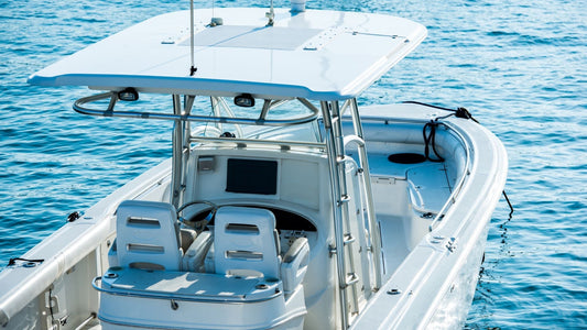 A boat on the water with fiberglass gunwales.
