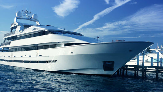 A luxury yacht tied to a boat dock.