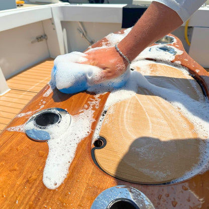 A premium boat washing sponge being used to clean a boat console.