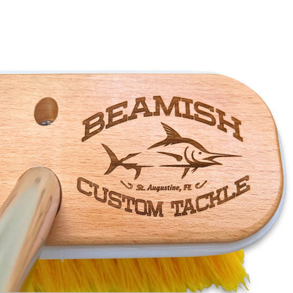 Close up of a personalized boat brush with laser etched fishing logo.
