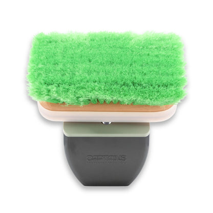 Front view of a TidyBoat brush head organizer with a green brush head inside.