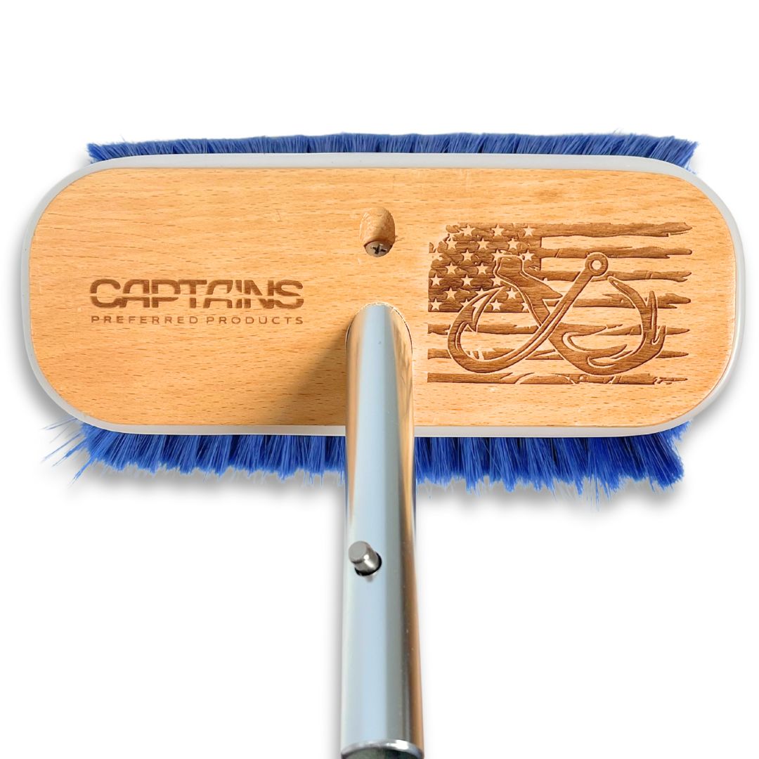 A customized boat brush with a fish hook, deer antler, and American flag design.