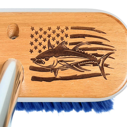 A tuna fishing and US flag laser-etched into a wooden boat brush head.