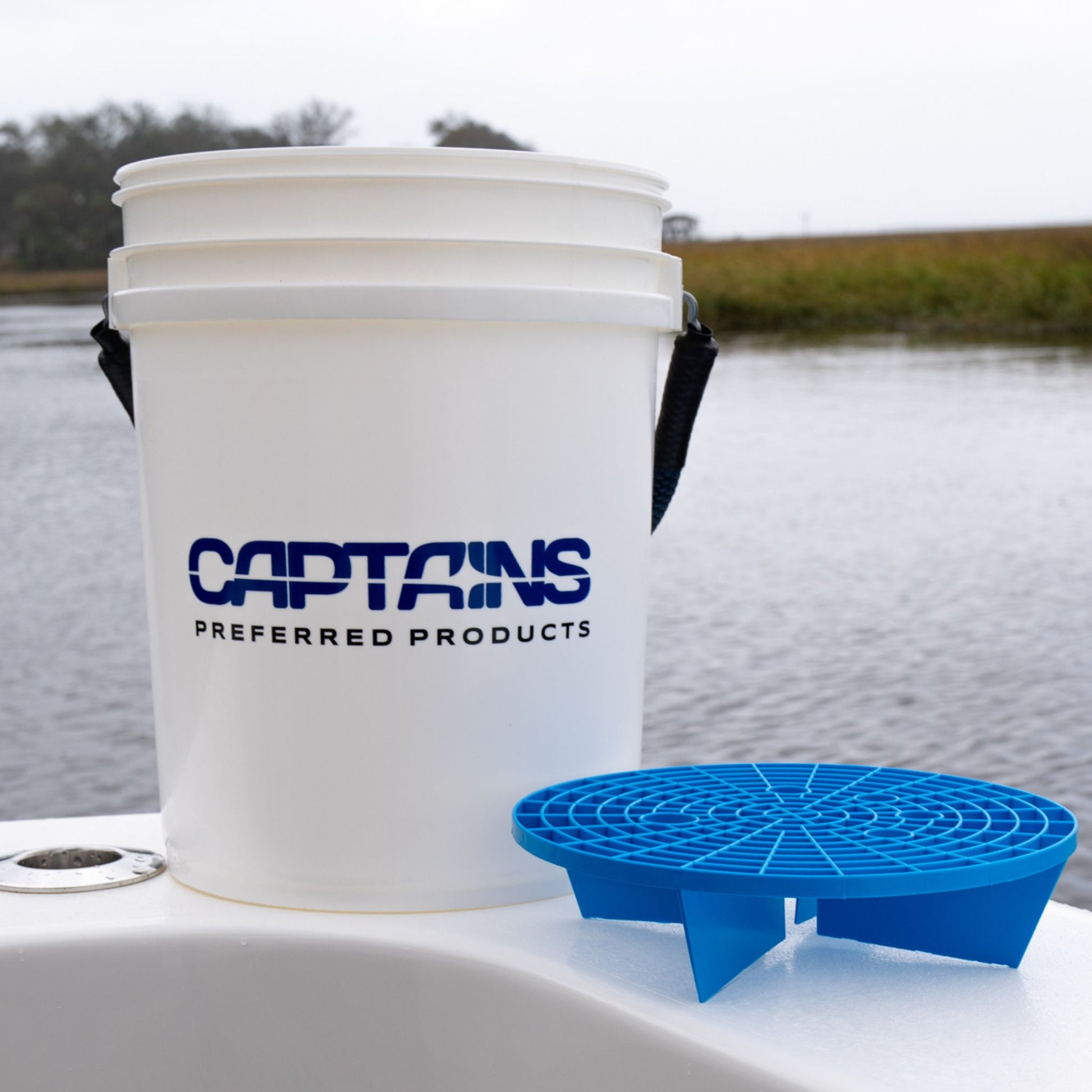 Captains Preferred Products' 5 gallon bucket with rope handle and dirt trap accessory.