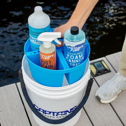 A blue bucket caddy holding boat cleaning supplies.