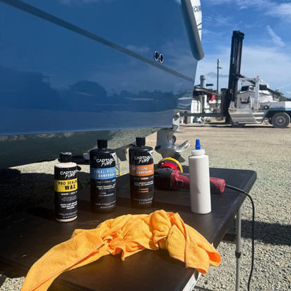 A professional boat detailer using Captain's Fury finishing compounds.