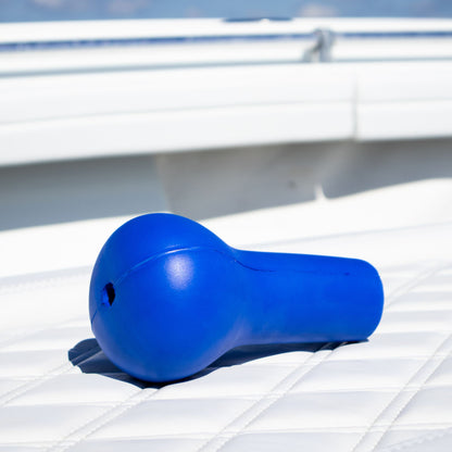 A blue fishing rod cushion sitting on a boat seat.