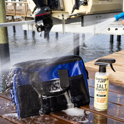 Spraying a Fishing Weight Lead Bag with Salt Remover and rinsing with fresh water after a fishing trip.