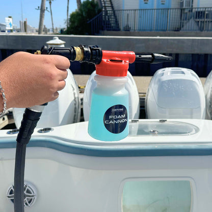 Captains Preferred Products foam cannon filled with soap and connected to a garden hose.