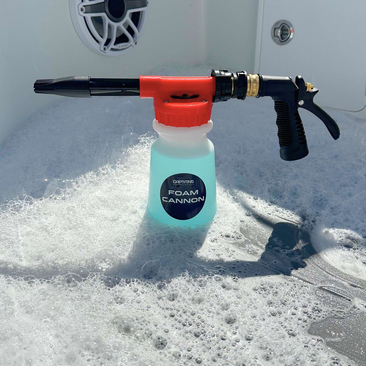 A foam cannon sitting in thick foam on a boat deck.