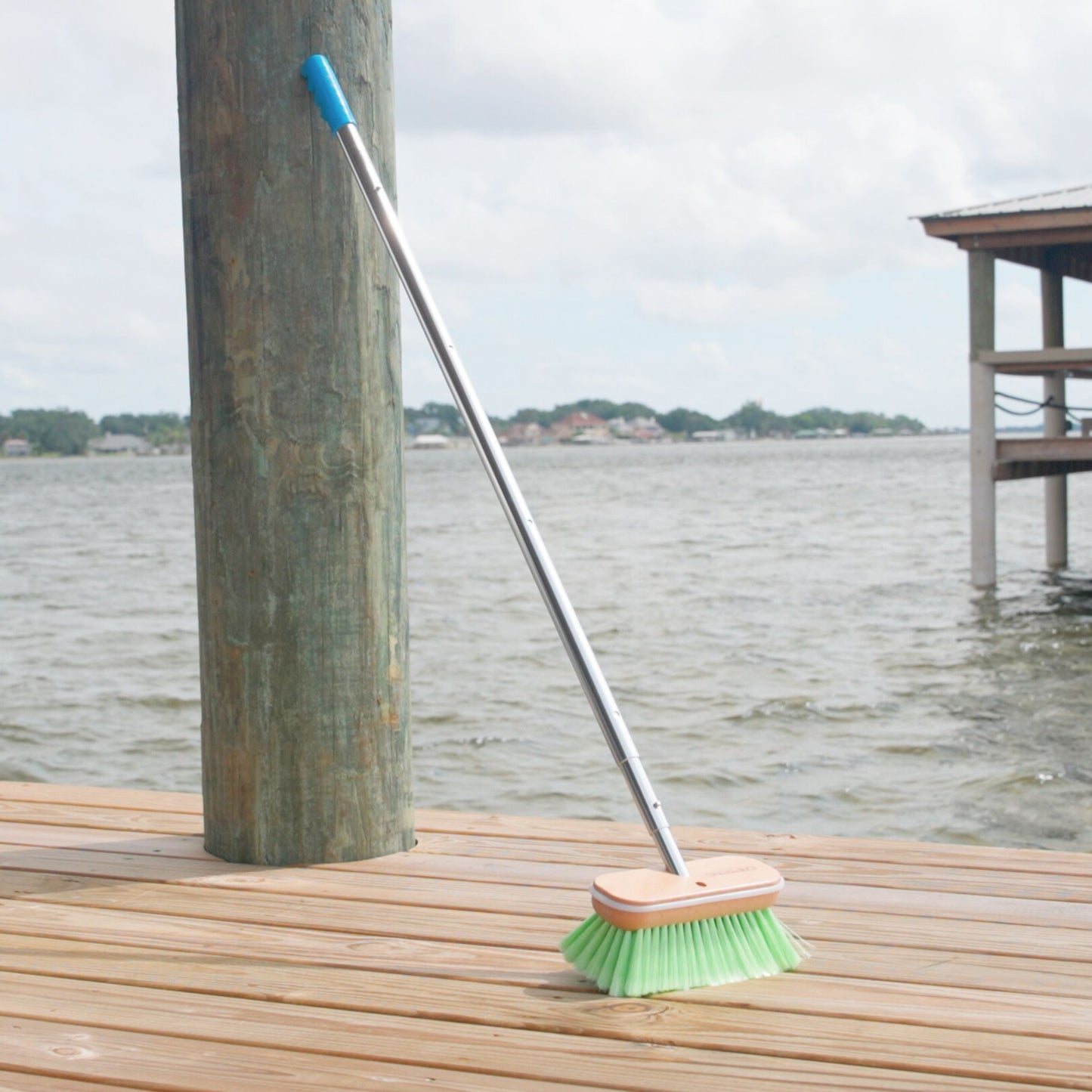 A green Medium boat brush head from Captains Preferred on a 6ft telescoping handle.