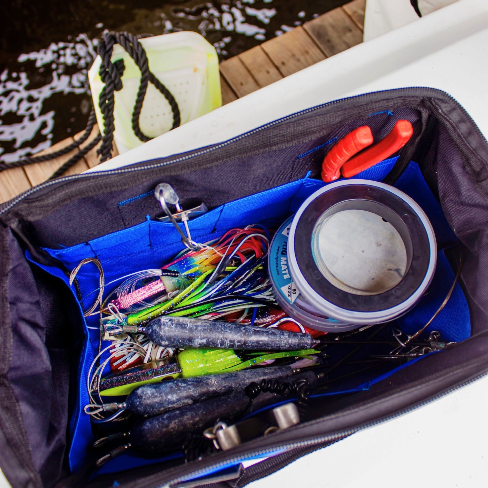 Inside a Fishing Weight Lead Bag from Captains Preferred Products that is full of weights and lures.