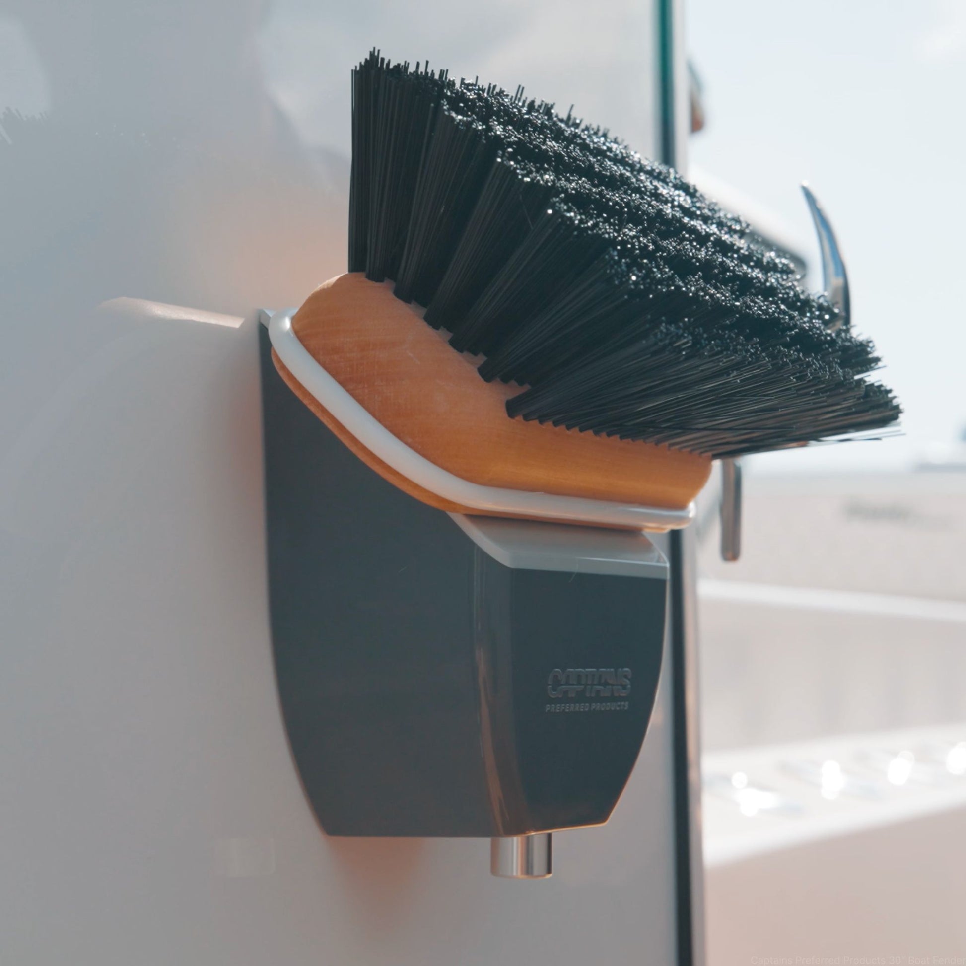 An installed boat brush head holder on a boat.
