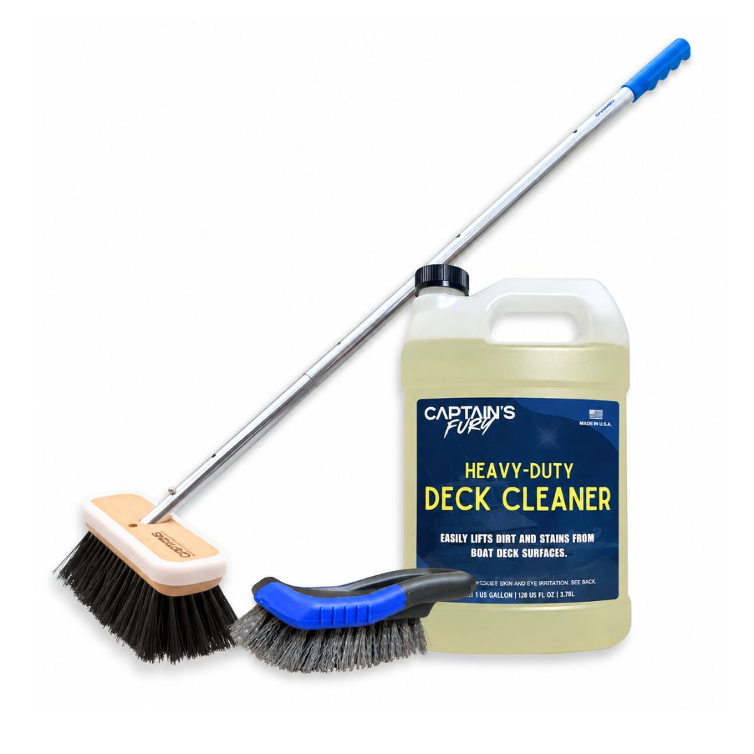 The deep scrub boat deck cleaning kit with a boat brush and handle, handheld scrub brush, and gallon of Heavy-Duty Deck Cleaner.