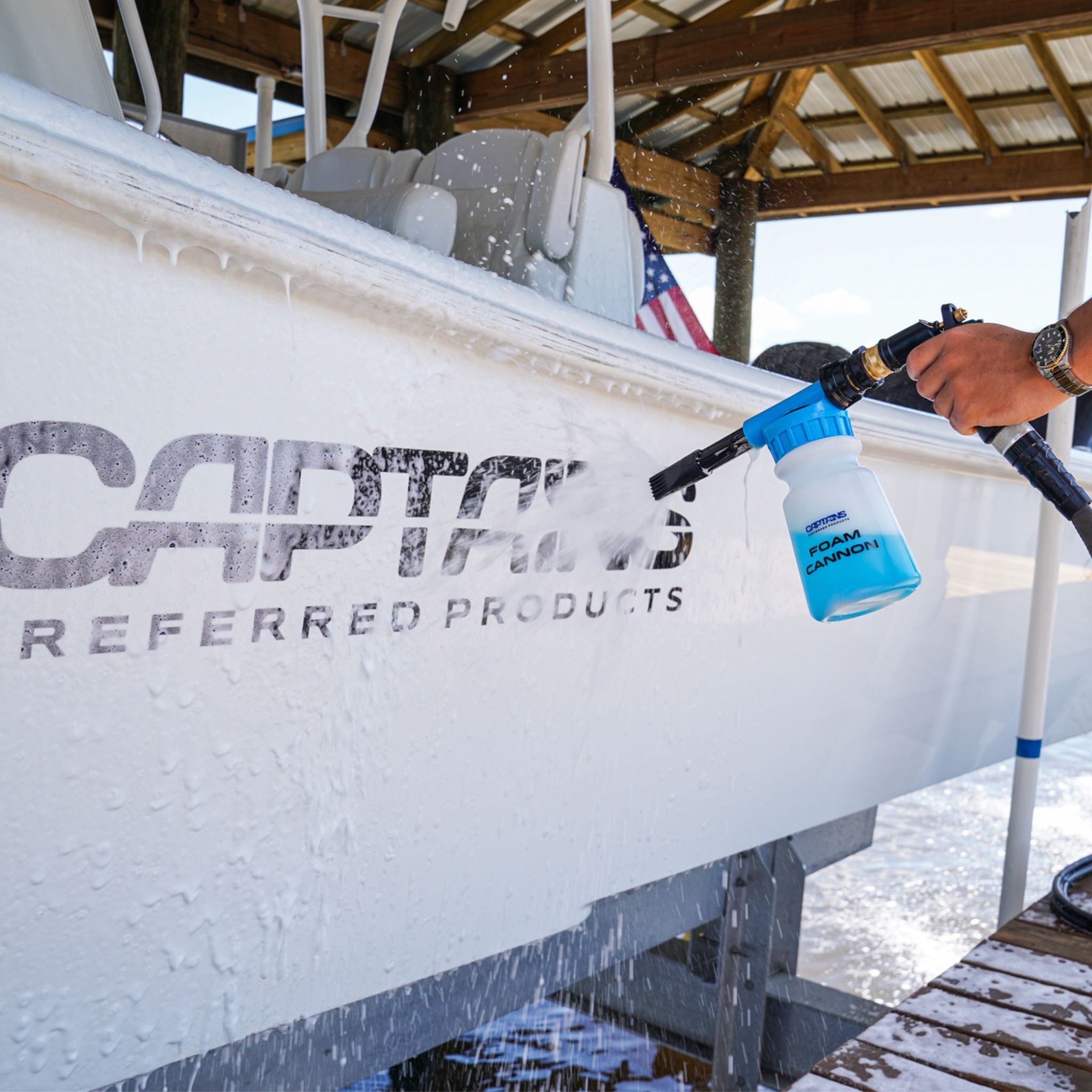 Foam cannon spraying foam on a boat.