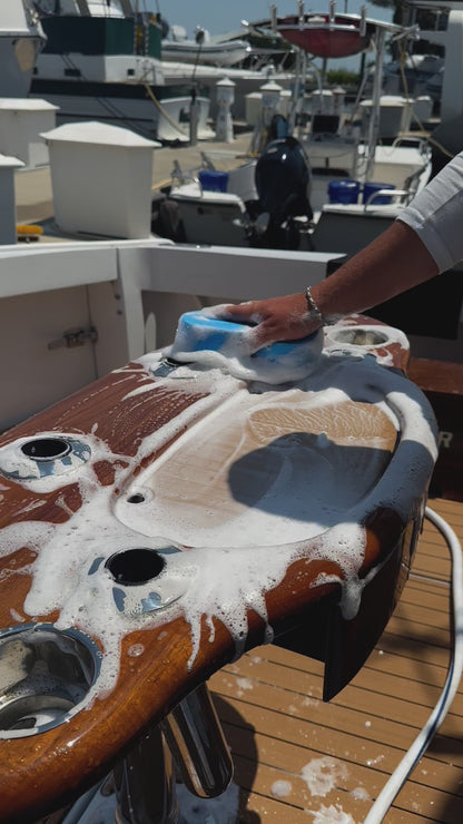 Captains Preferred Products boat sponge being used to clean off a boat console.